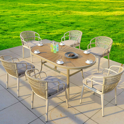 Akeesha Oval 6 - Person 62.99" Long Dining Set with Cushions